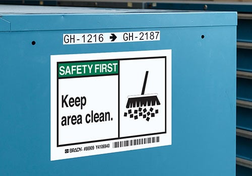 Sign that says &quot;Safety first, keep area clean&quot;