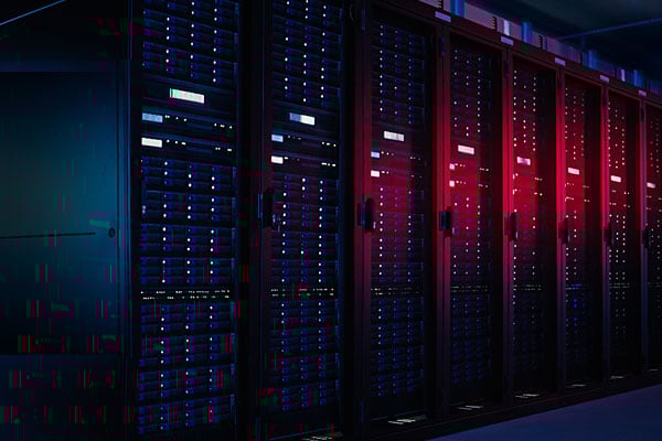 Red and blue lighting on servers in data room. 