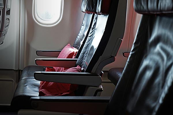 Closeup of a row of airplane seats.