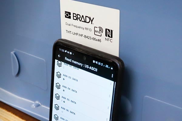 Smartphone in front of label