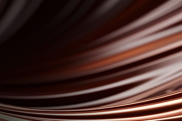 Closeup image of swirled white and dark chocolate.