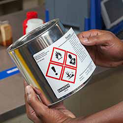 Brady label on a can with hazardous material