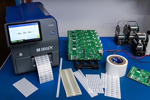 Brady printer and materials on a work table