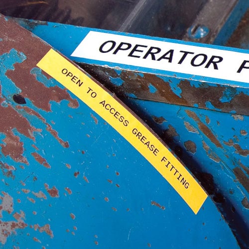 A label on a rusty machine