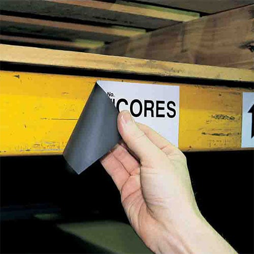a magnetic label being peeling off a wall