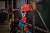 Brady Velocity padlocks attached to a clamping handle cable lockout.