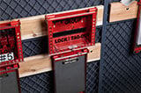 Red group lockout tagout lockbox with space for 26 padlocks.