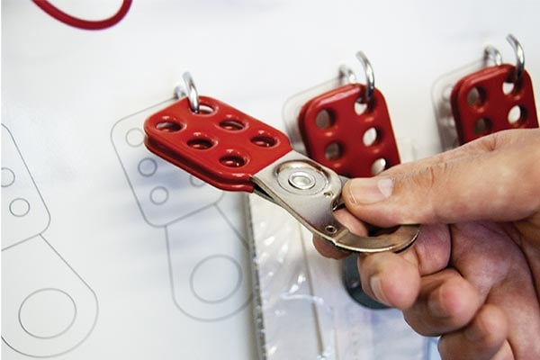 Hasp being put on a shadowboard.