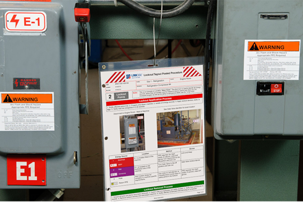 LOTO procedure sheet and arc flash warning labels on two electrical panels.