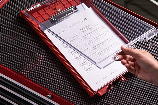 A lockout tagout compliance list on a clipboard