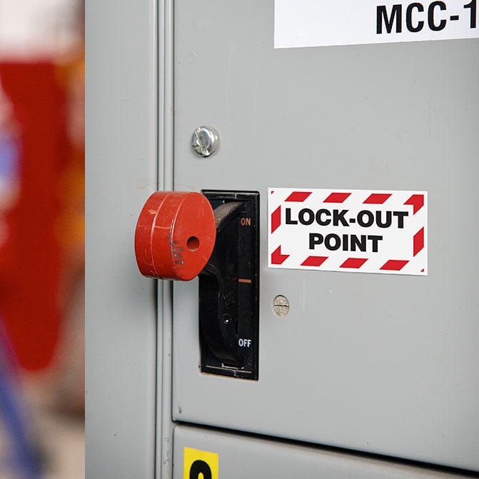 a lock-out point tag next to a control arm