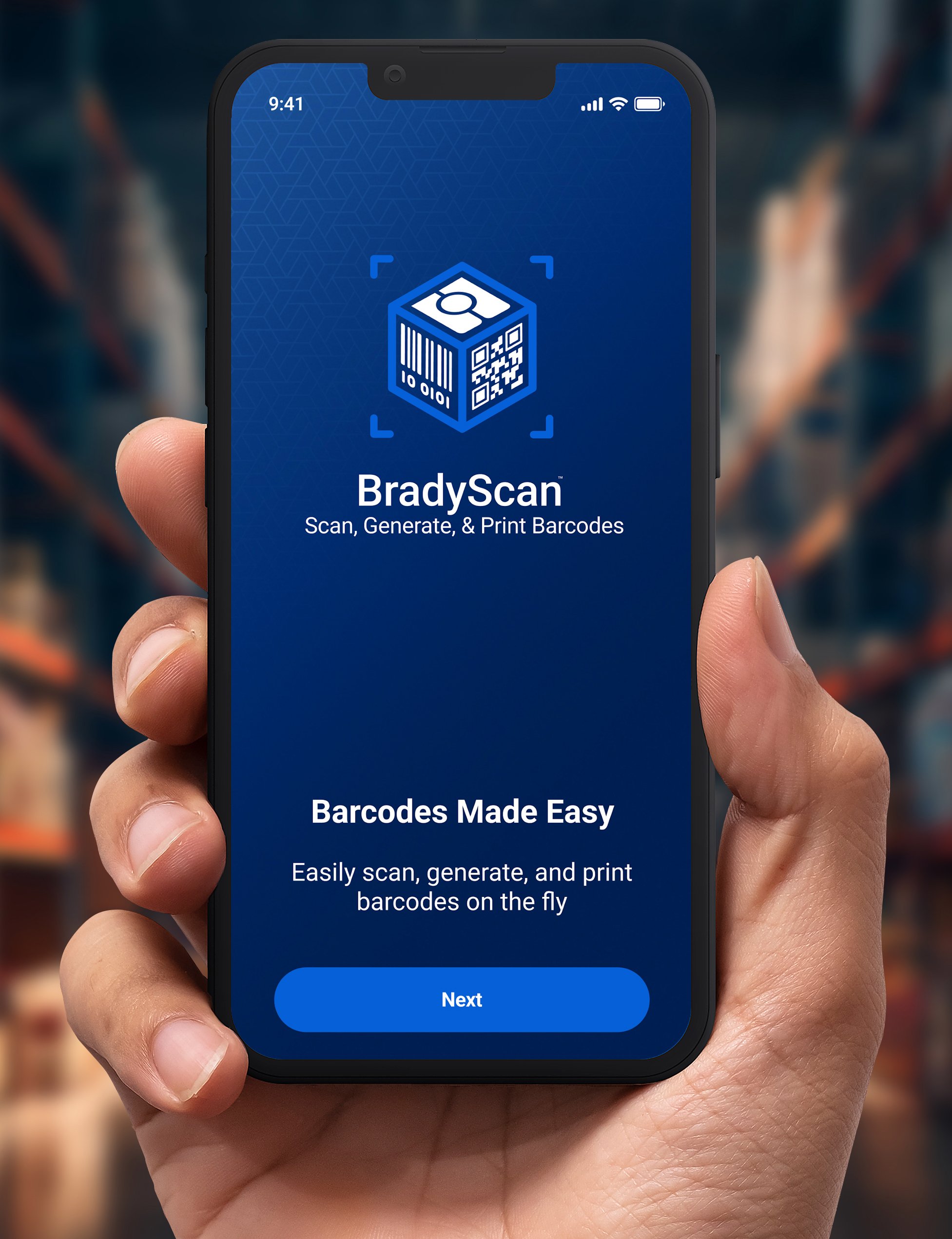 A hand holding a smartphone with BradyScan software on the screen.