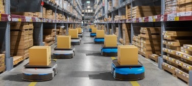 Group of Automated Mobile Robots (AMRs) working in a warehouse environment.