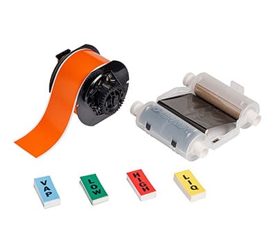 Group of Brady printing supplies: labels, ribbon and roll.