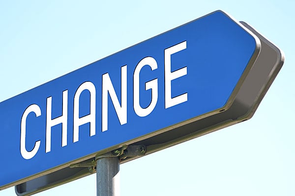 Blue arrow sign with the word CHANGE.