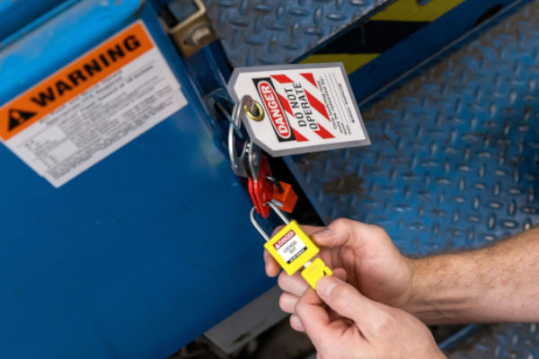 Applying Brady padlocks and tags to prevent incidents.