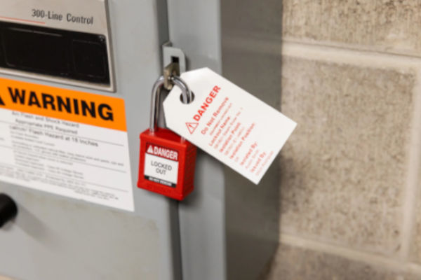 A Brady Velocity safety padlock and tag preventing accidental electrical discharge.
