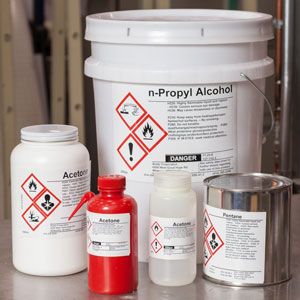 Chemical containers with Brady B30 Series GHS CLP Chemical Labels.