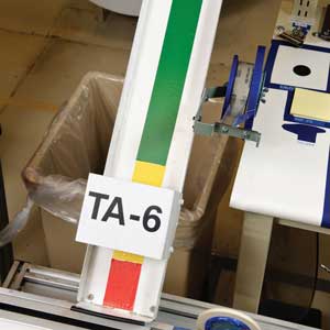 Inventory rack labeled &#x27;TA-6&#x27; with Brady color inventory labels.