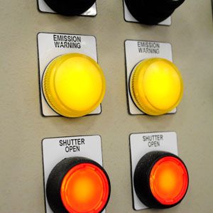 Industrial control panel with warning lights.