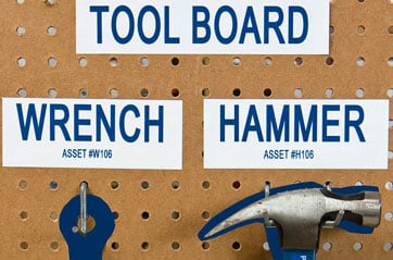 Brady shadow board with wrench and hammer labels.