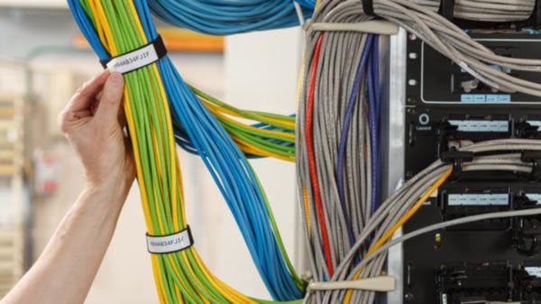 A server rack of cables organized by Brady cable solutions to adhere to structured cabling standards.