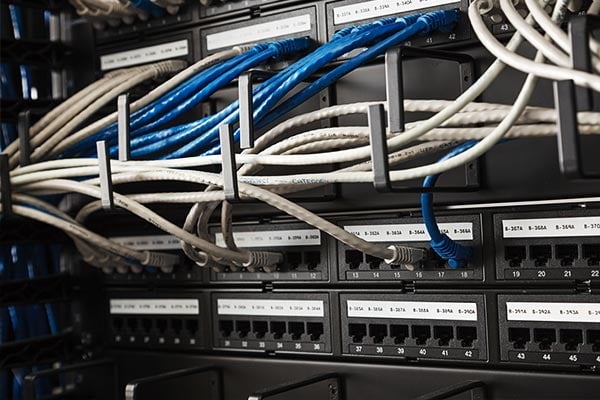 A data center server rack with labeled patch panels.