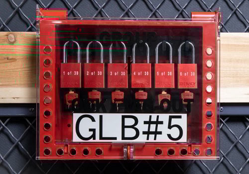 A red Brady GLB26 Group LOTO box filled with padlocks.