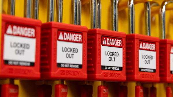Row of red Brady lockout padlocks.