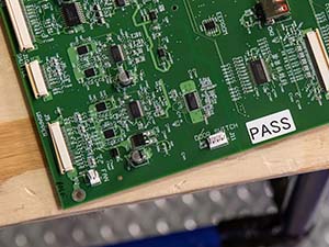 Closeup of a green printed circuit board (PCB). 