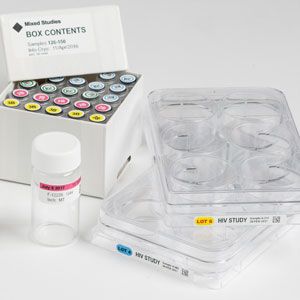 Closeup of a box of labeled vials and clear plastic containers. 