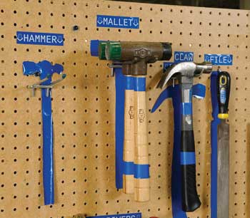 A Brady tool shadow board with hammers. 