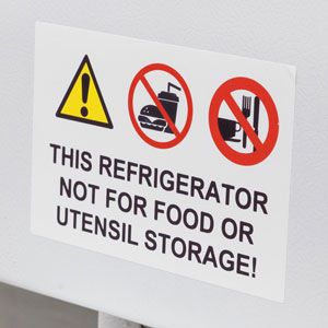 Sign on a lab refrigerator showing no food allowed.