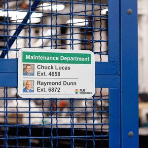 Sign at a warehouse with pictures and names of department employees.