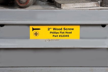 Industrial storage drawer with sign indicating 2&quot; screws go inside. 
