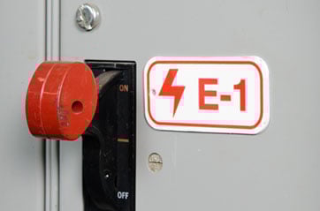  An electrical lever with a lockout device and warning label.