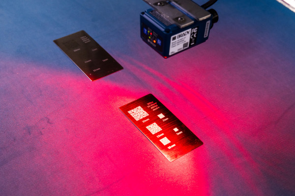 Barcodes on circuit boards being scanned with a fixed scanner.