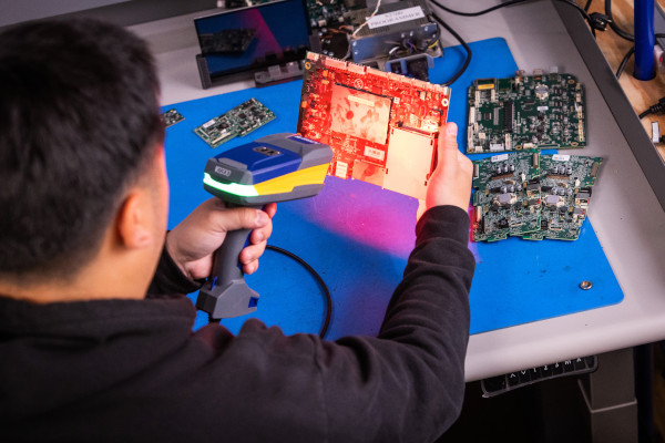 Scanning a barcode on a circuit board with a Brady scanner.