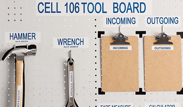 A Brady shadowboard with tools like hammer and wrench.