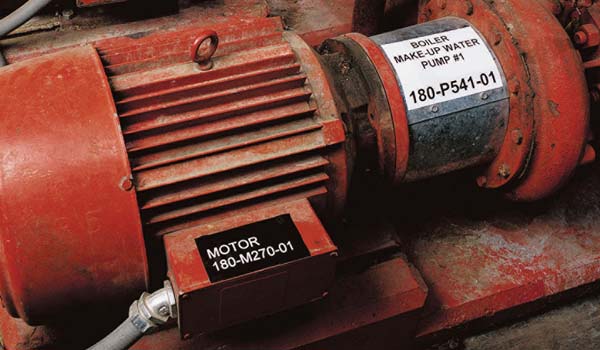An industrial motor and pump assembly with label.