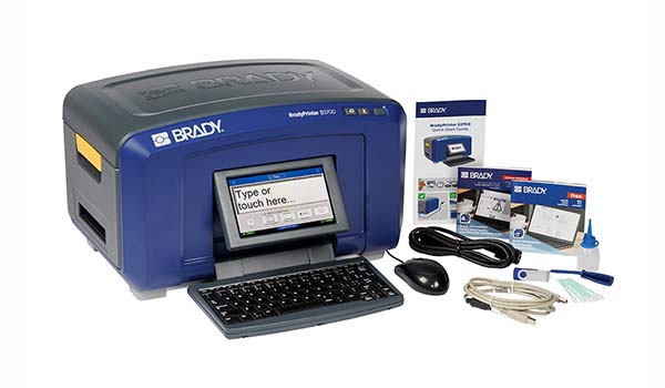 A Brady desktop printer with instructions and cables.