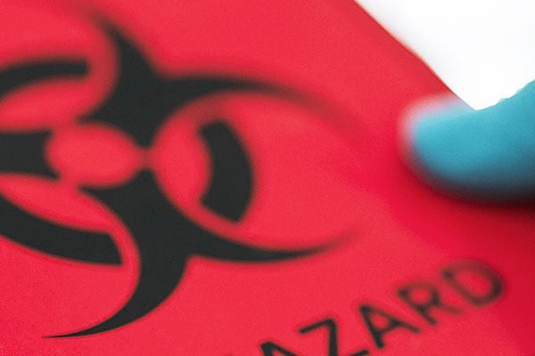 Closeup of a red biohazard label.