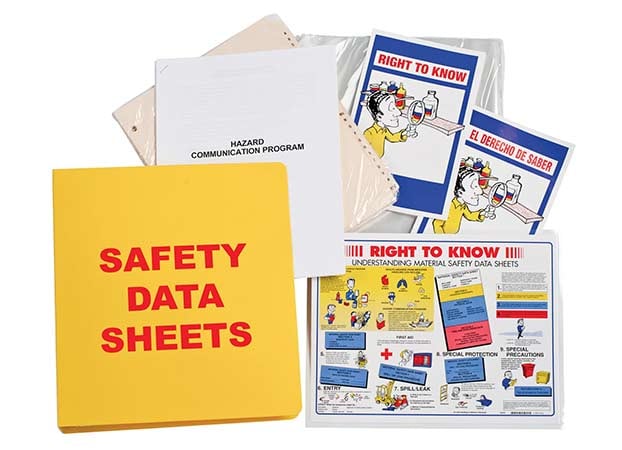 A collage of safety data sheets outside a yellow binder.
