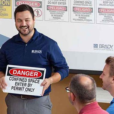 Trainer instructs employees on use of danger signs and protocol.