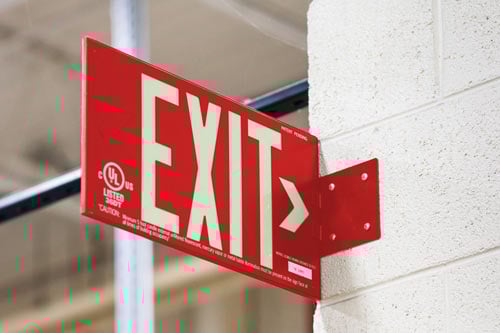 Closeup of a red exit sign.