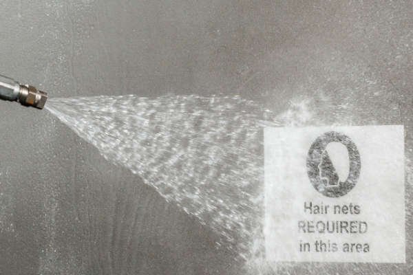 Toughwash safety sign withstanding a washdown procedure.