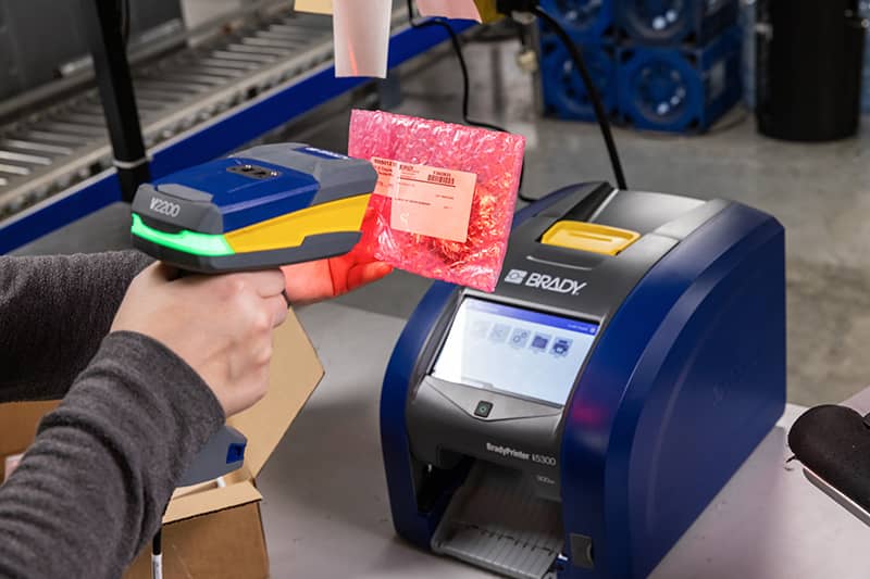 A Brady V2200 Scanner reading a barcode.