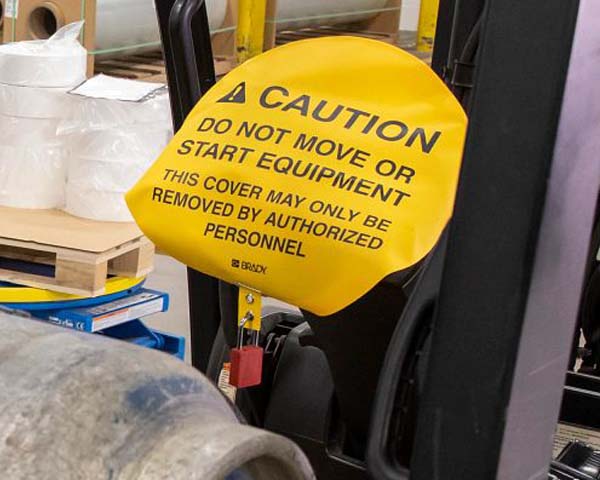A caution &quot;do not move or start&quot; tag over equipment. 