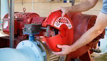 Brady 148646 gate valve lockout being placed on a valve.