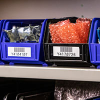 Shelves labeled with bar codes.